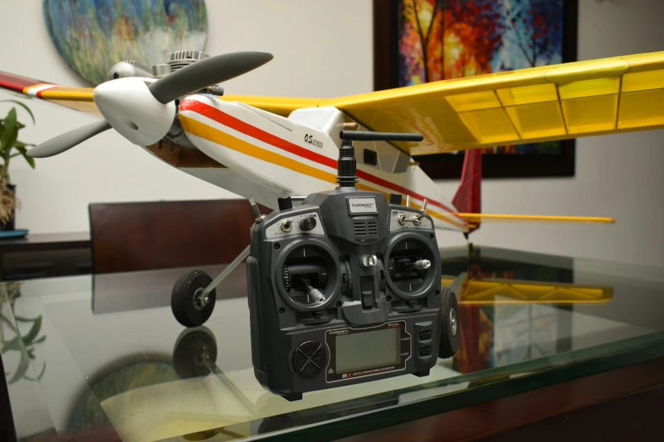 A model airplane sitting on top of a glass table